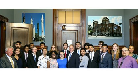Students meet with Sen. Doug Jones, center, prior to his introduction of the Cold Case Act in the US Senate on July 10, 2018.
