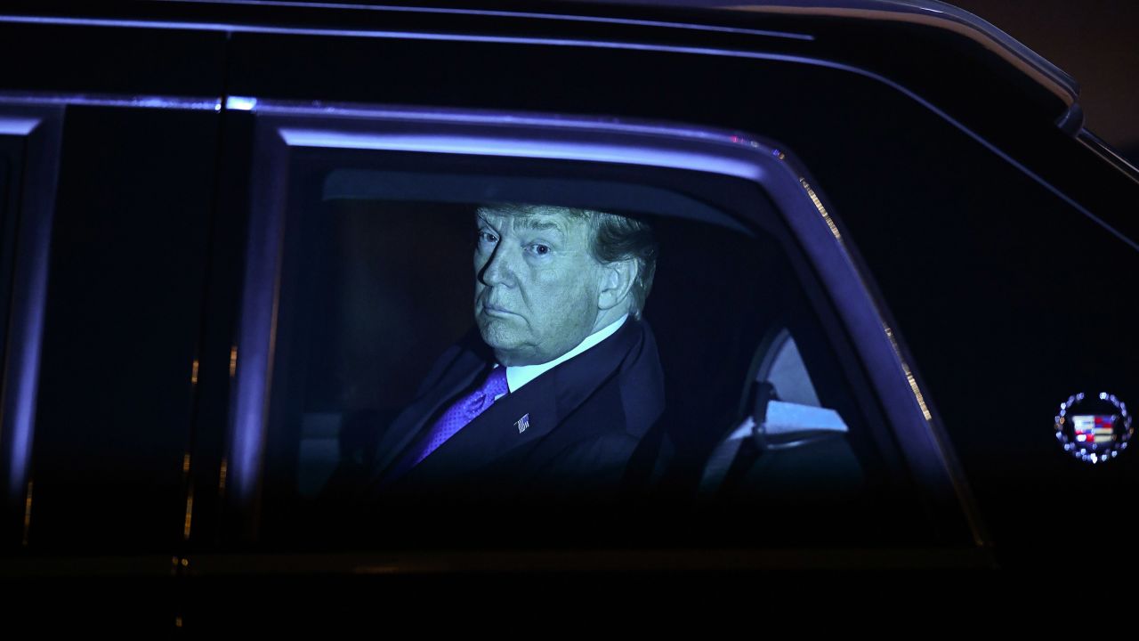 Trump looks out of his car after arriving in Hanoi late on Tuesday, February 26.