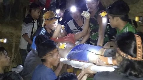 Indonesian Search And Rescue Agency (BASARNAS) rescuers evacuate a survivor from a collapsed gold mine in Bolaang Mongondow, North Sulawesi, Indonesia.