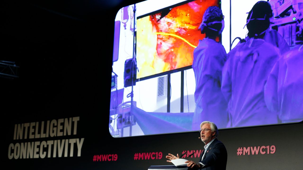 Dr. Lacy speaks on stage at Mobile World Congress.