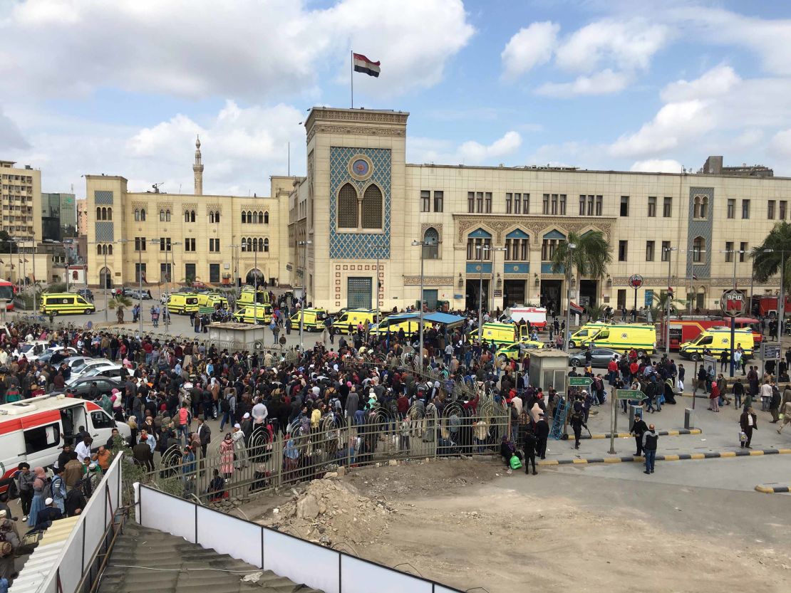 Crowds gather outside the main train station (on background) in Cairo, Egypt. 