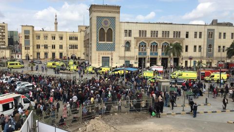 Crowds gather outside the main train station (on background) in Cairo, Egypt.