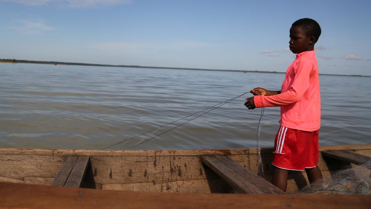 A child slave untangles a fishing net on Lake Volta, Ghana, November 2018.