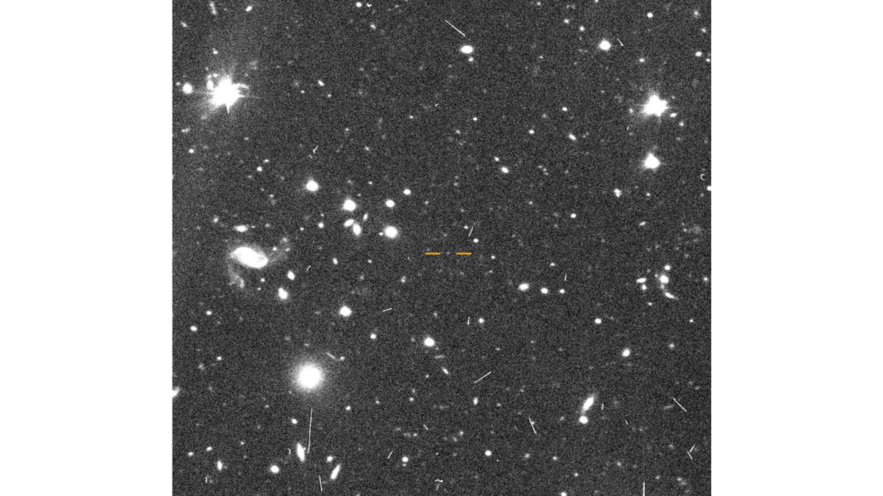 The discovery image of FarFarOut is marked by lines. It's surrounded by clusters of galaxies.