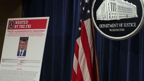 A wanted poster for FSB officer Dmitry Aleksandrovich Dokuchaev is displayed at the Justice Department on March 15, 2017.