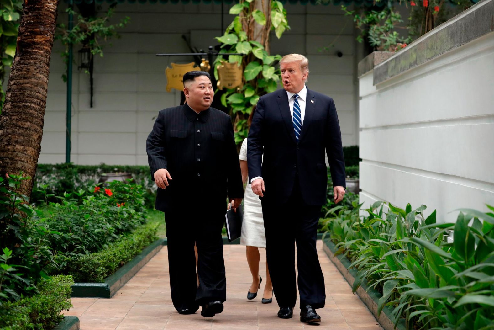 Kim and Trump take a walk outside the Hotel Metropole on February 28. <a href="index.php?page=&url=https%3A%2F%2Fwww.cnn.com%2Fpolitics%2Flive-news%2Ftrump-kim-jong-un-summit-vietnam-february-2019%2Fh_22700ef4fad83bba147f714d6317693d" target="_blank">They were due to have a friendly chat beside the hotel's pool,</a> but the humid conditions reportedly forced a change in plans and the two moved inside.