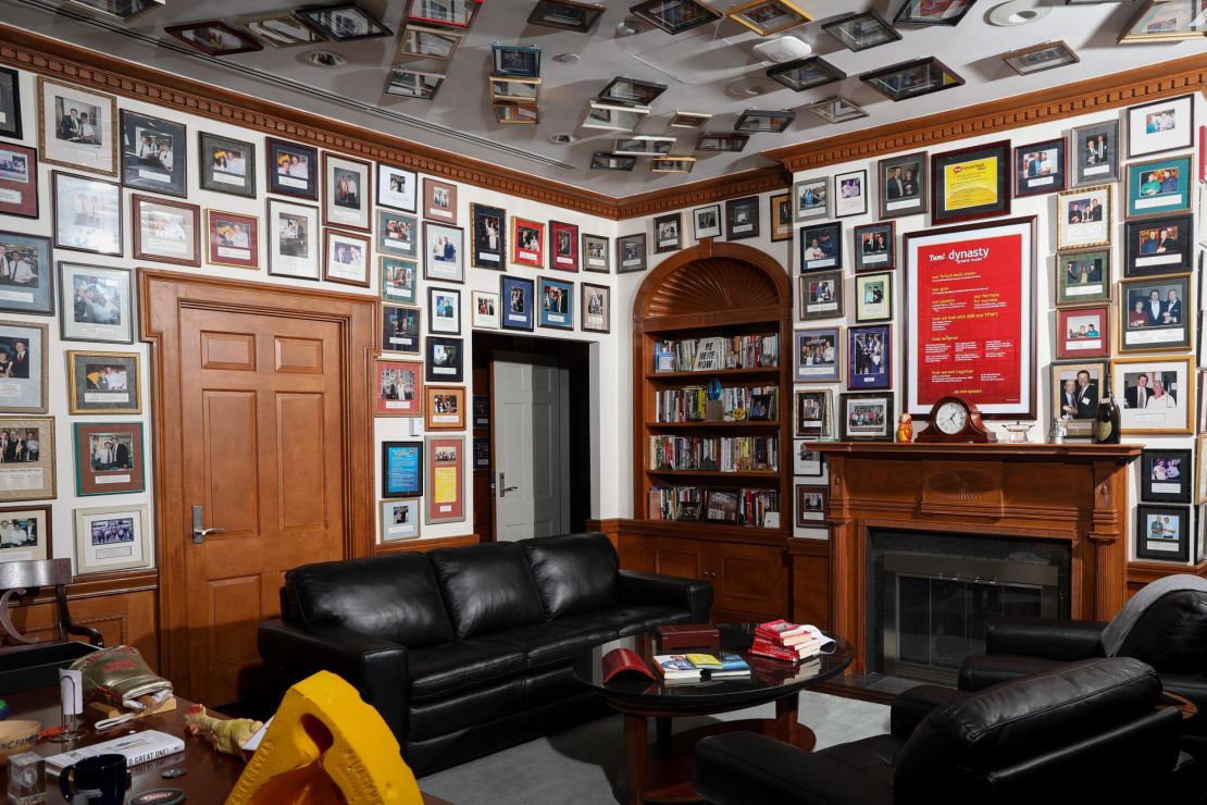 Novak's office walls and ceiling are lined with photos of him with former employees and their recognition awards. 