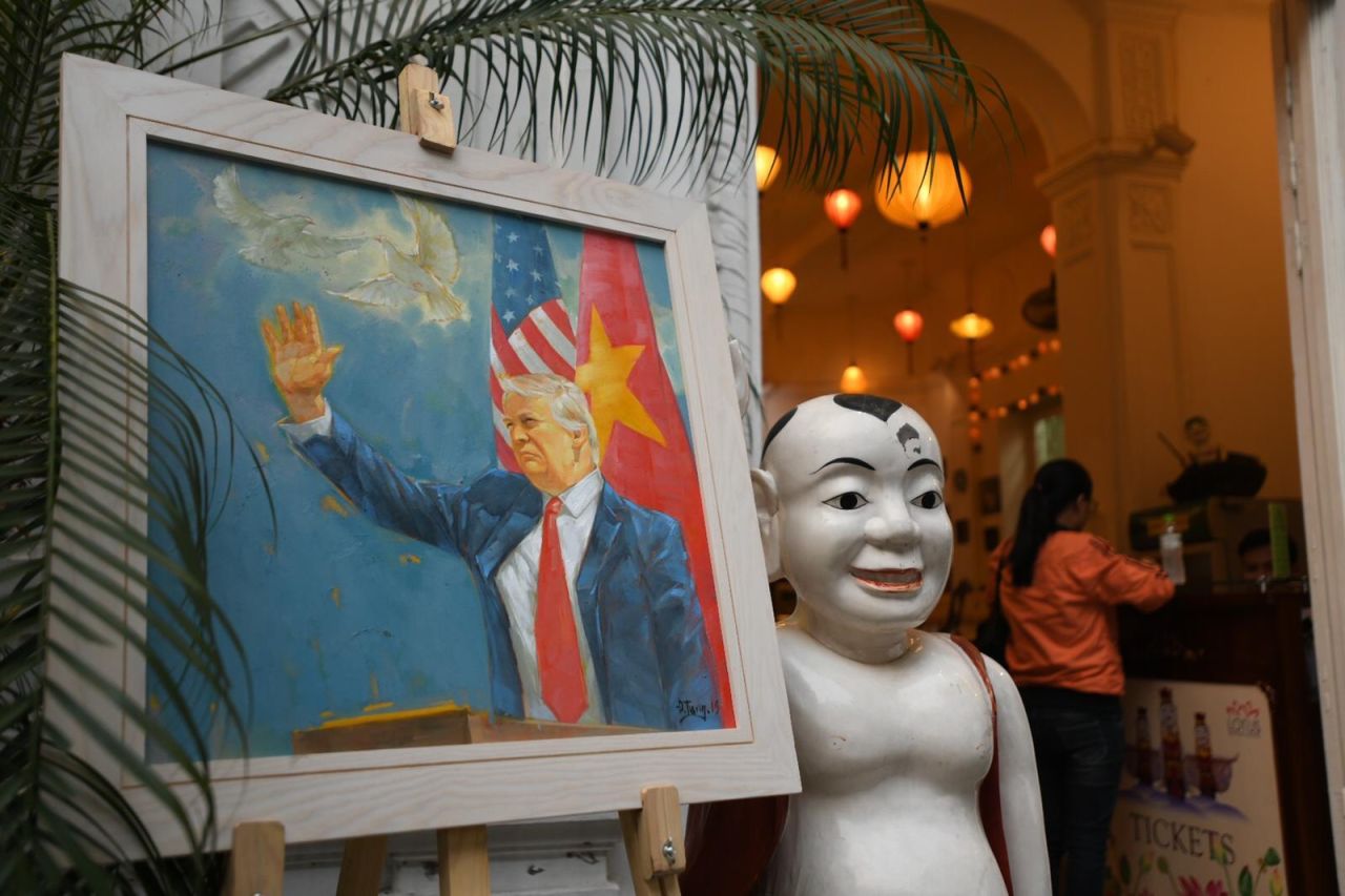 The famous Lotus Water Puppet Theater erected portraits of the two leaders, one showing Trump waving in front of the US and Vietnamese flags. 