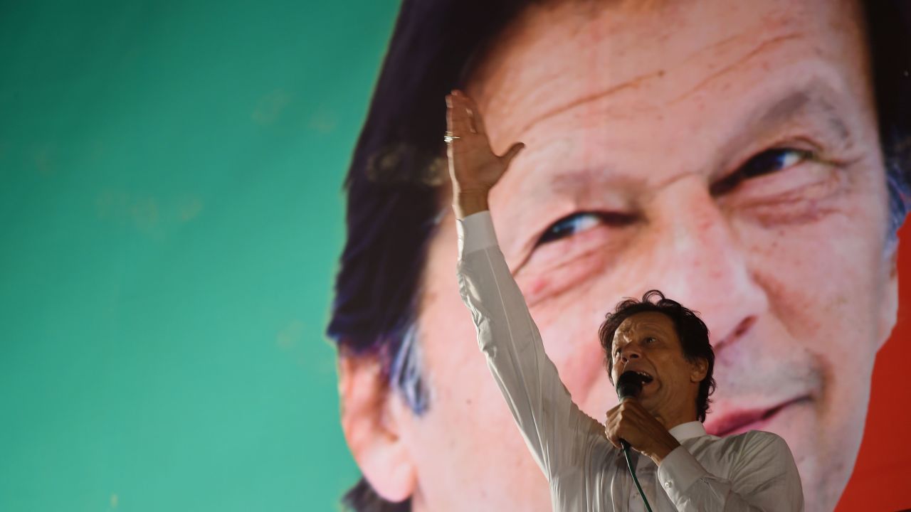 Pakistani cricket star-turned-politician and head of the Pakistan Tehreek-e-Insaf (PTI) Imran Khan gestures as he delivers a speech during a political campaign rally in July 21, 2018.