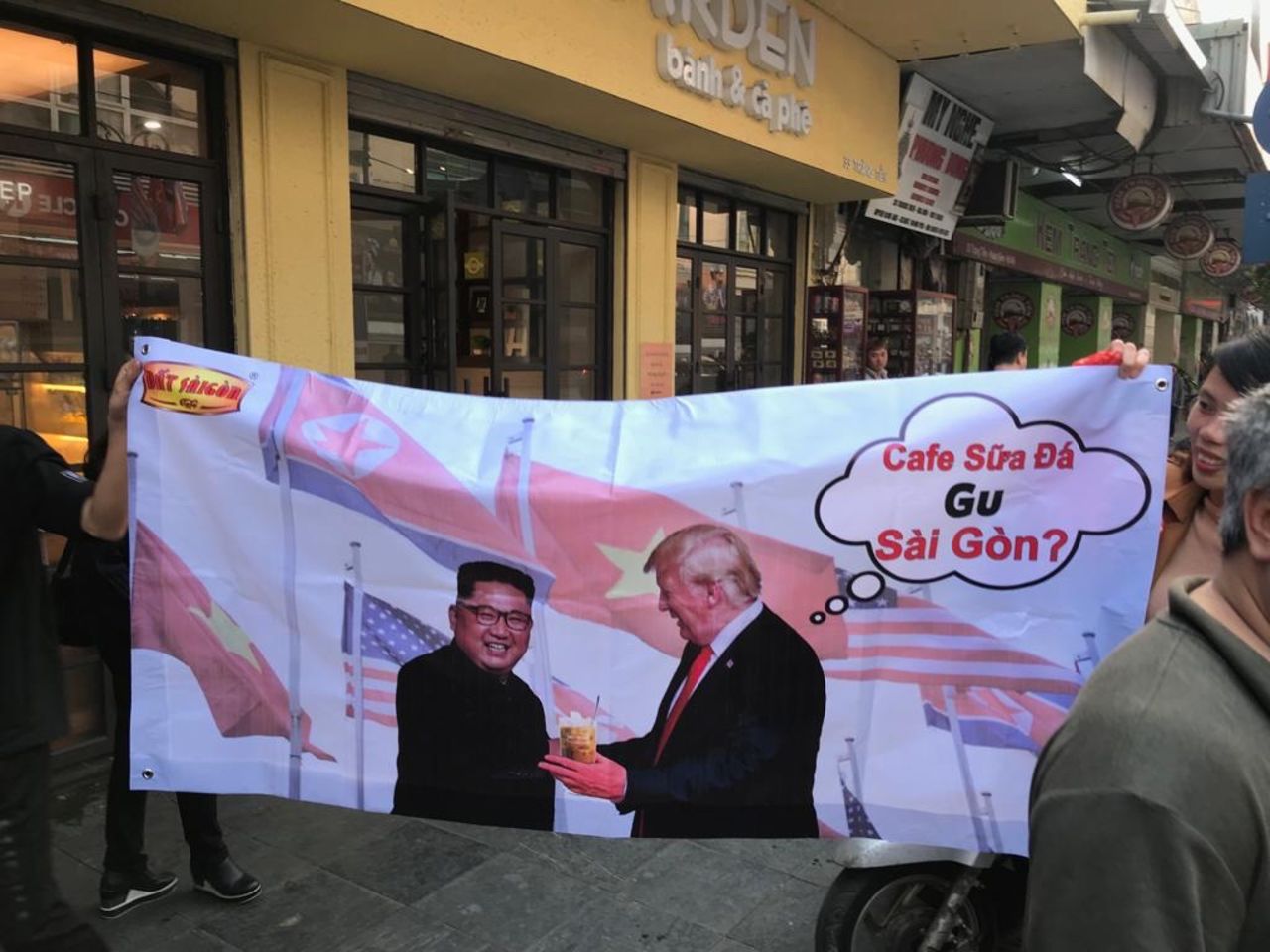 Vendors used images of US President Donald Trump and North Korean leader Kim Jong Un to sell their products. In this banner, the leaders smile over a cup of local coffee. 