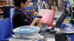 A cashier scans an item at a Walmart Inc. store in Burbank, California, U.S., on Monday, Nov. 19, 2018. To get the jump on Black Friday selling, retailers are launching Black Friday-like promotions in the weeks prior to the event since competition and price transparency are forcing retailers to grab as much share of the consumers' wallet as they can. Photographer: Patrick T. Fallon/Bloomberg via Getty Images