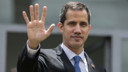 TOPSHOT - Venezuelan opposition leader and self-declared acting president Juan Guaido, waves after holding a meeting at the European Union headquarters in Brasilia on February 28, 2019. - Venezuela's opposition leader Juan Guaido arrived early Thursday in Brazil for talks aimed at securing more support from President Jair Bolsonaro, press reports said. There are fears he might be arrested upon his return to Venezuela. (Photo by Sergio LIMA / AFP)        (Photo credit should read SERGIO LIMA/AFP/Getty Images)