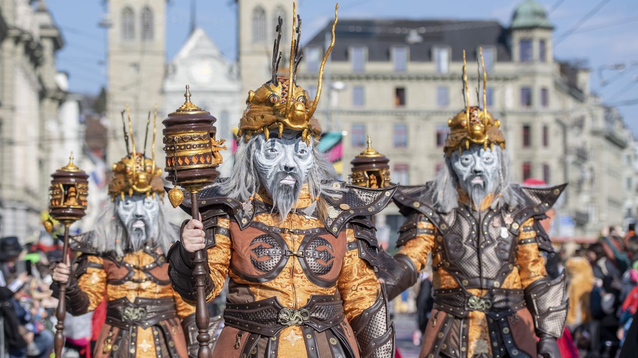 <strong>Lucerne, Switzerland:</strong> Masked revelers parade through the streets in Lucerne on Thursday, February 28. In the central part of the mountainous nation, Lucerne's lovely lakeside setting and medieval buildings make it a popular destination.