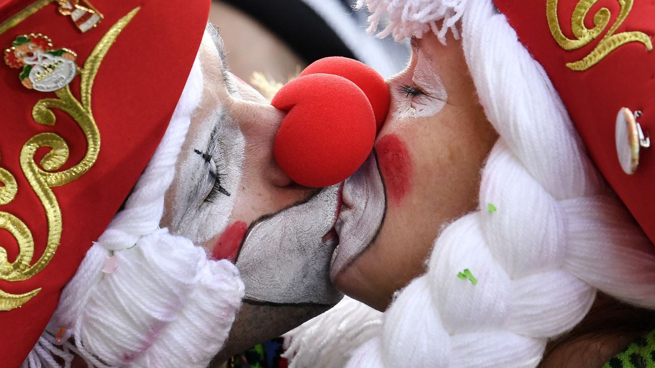 <strong>Cologne, Germany:</strong> Two revelers kiss in Cologne's city center on Thursday, February 28, to celebrate the start of the "Crazy Days." Technically, Cologne starts its Carnival on November 11, but it's the six "Crazy" days before Ash Wednesday when things ramp up.