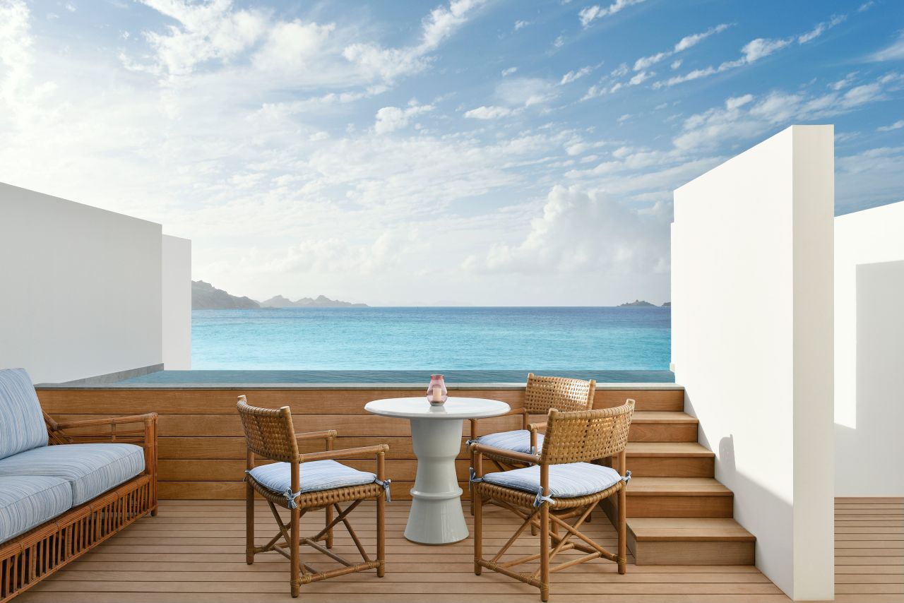 <strong>Beachfront bliss:</strong> Cheval Blanc's rooms have touches of turquoise and furniture in a mix of styles, making them far from a cookie-cutter hotel room.
