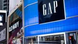 Pedestrians pass in front of Gap Inc. and Old Navy Inc. stores in the Times Square area of New York, U.S., on Wednesday, Dec. 13, 2017. Bloomberg is scheduled to release consumer comfort figures on December 21. Photographer: Mark Kauzlarich/ Bloomberg