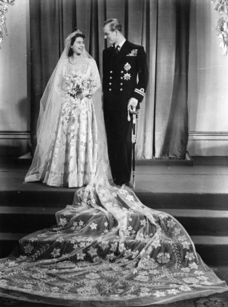 November 20, 1947: Princess Elizabeth with Prince Philip on their wedding day. The bride's gown was designed by Norman Hartnell.