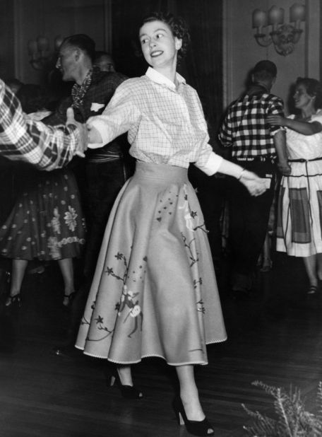 October 1951: Then Princess Elizabeth square dances during a state visit to Canada in a shirt and skirt. 