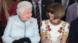 LONDON, ENGLAND - FEBRUARY 20:  Queen Elizabeth II sits next to Anna Wintour as they view Richard Quinn's runway show before presenting him with the inaugural Queen Elizabeth II Award for British Design as she visits London Fashion Week's BFC Show Space on February 20, 2018 in London, United Kingdom. (Photo by Yui Mok - Pool/Getty Images)