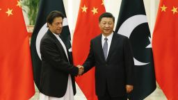 China's President Xi Jinping (R) shakes hands with Pakistan's Prime Minister Imran Khan (L) ahead of their meeting at the Great Hall of the People in Beijing on November 2, 2018. (Photo by THOMAS PETER / POOL / AFP)        (Photo credit should read THOMAS PETER/AFP/Getty Images)