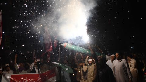 Pakistani supporters of Pasban Democratic Party celebrate the Pakistan Air Force (PAF) for shooting down Indian fighter jets, in Karachi on February 27, 2019. 