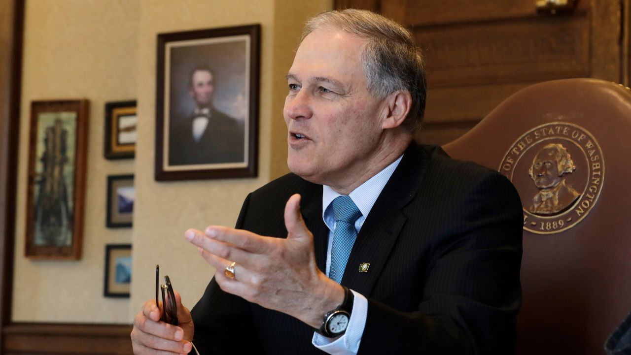 Washington Gov. Jay Inslee speaks during a morning meeting with staff members in his office, Wednesday, February 27, 2019, at the Capitol in Olympia, Washington.