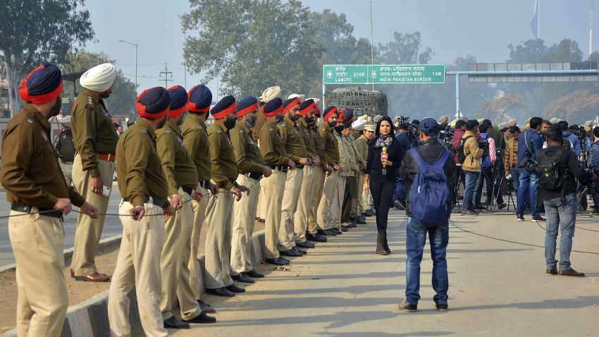Officers await the return of the Indian pilot on the Indian side of the Wagah border crossing on Friday, March 1, 2019.