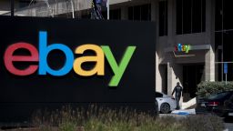 A pedestrian walks past eBay Inc. signage at the entrance to the company's headquarters in San Jose, California, U.S., on Tuesday, Janary 24, 2017. 