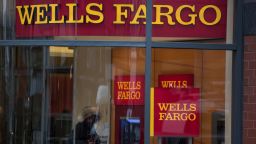 A customer uses an ATM (automated teller machine) at a Wells Fargo & Co. bank branch in New York, U.S., on Monday, Dec. 8, 2014. U.S. stocks dropped, following the worst loss in six weeks for the Standard & Poor's 500 Index, as global shares slid on concern over growth in China and potential political turmoil in Greece. Photographer: Ron Antonelli/Bloomberg via Getty Images