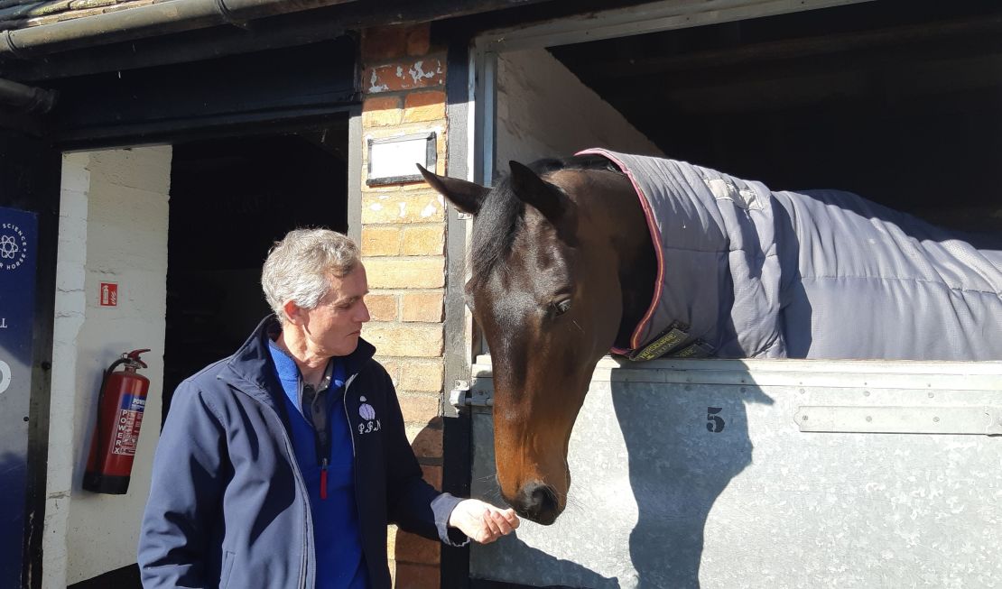 Head lad Clifford Baker shares a moment with stable star Clan Des Obeaux.