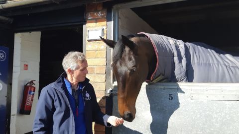 Head lad Clifford Baker shares a moment with stable star Clan Des Obeaux.