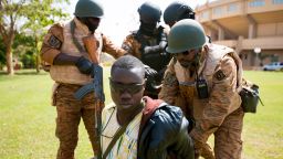 Burkinabe soldiers gain custody of a terrorist during a simulated terrorist attack in Ouagadougou, Burkina Faso on Feb. 27, 2019 during Flintlock 2019. The Burkinabe army was responsible for cordoning off the surrounding area and securing any surviving terrorists. (U.S. Army photo by Staff Sgt. Anthony Alcantar)