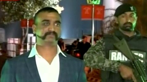Indian pilot, Wing Commander Abhinandan, stands under armed escort near Pakistan-India border in Wagah, Pakistan in this March 1, 2019 image from a video footage.