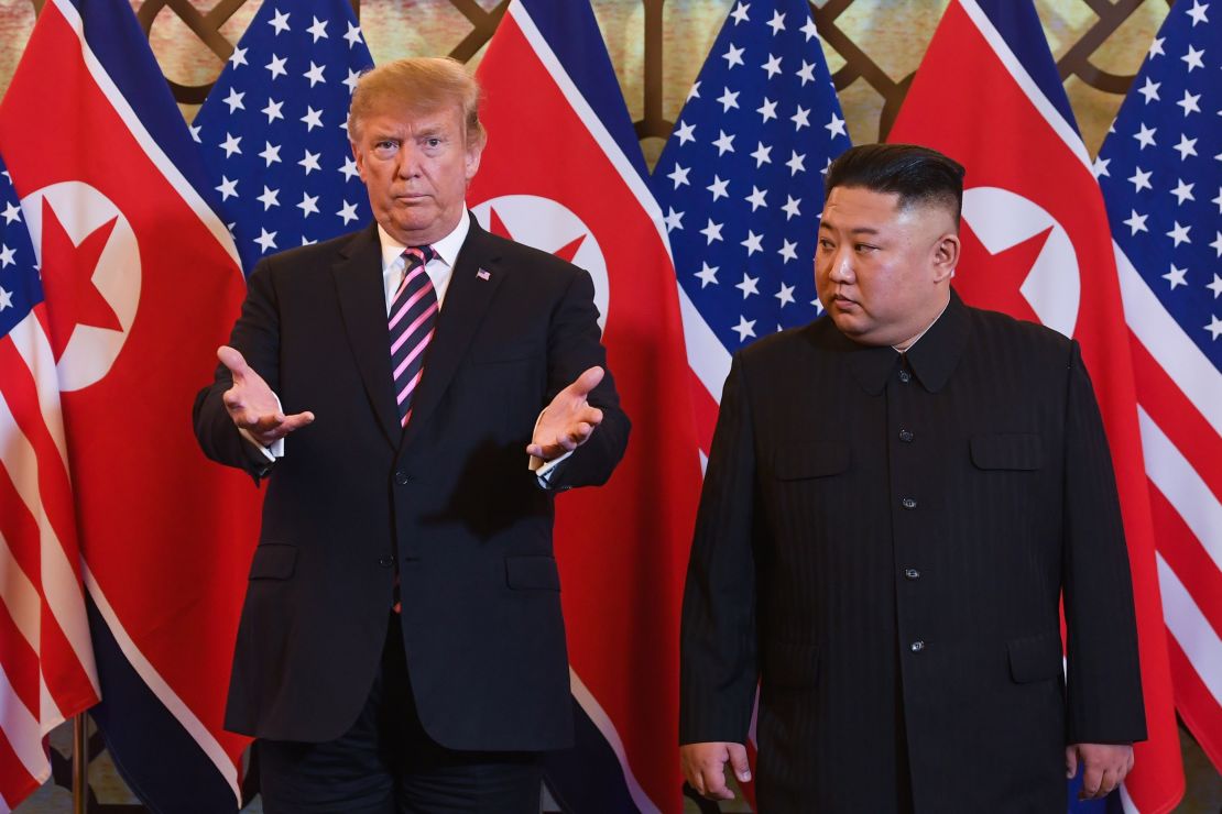 US President Donald Trump, left, and North Korea's leader Kim Jong Un arrive for a meeting at the Sofitel Legend Metropole hotel in Hanoi on February 27, 2019. 