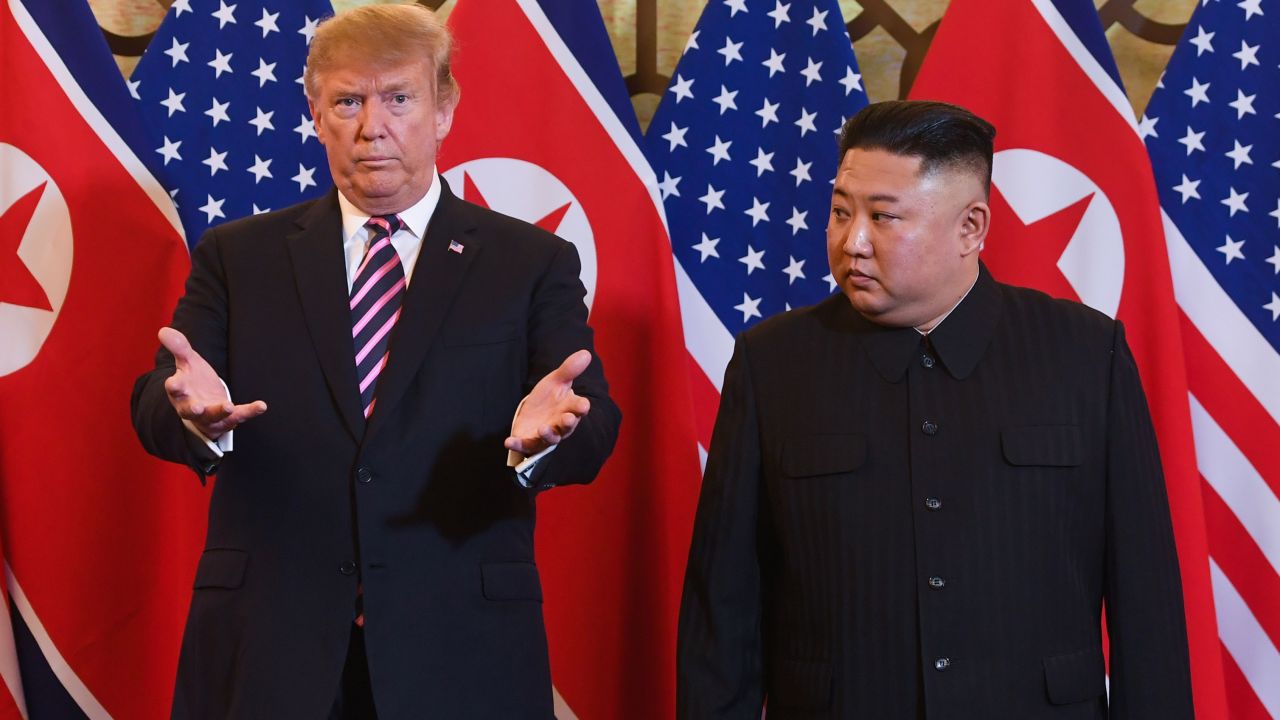 US President Donald Trump, left, and North Korea's leader Kim Jong Un arrive for a meeting at the Sofitel Legend Metropole hotel in Hanoi on February 27, 2019.