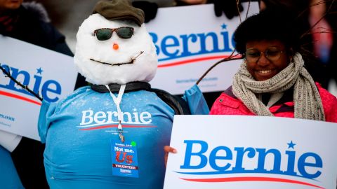 Supporters of US Senator Bernie Sanders pose with a snow man before a rally to kick off his 2020 US presidential campaign, in the Brooklyn borough of New York City, on March 2, 2019 in. 
