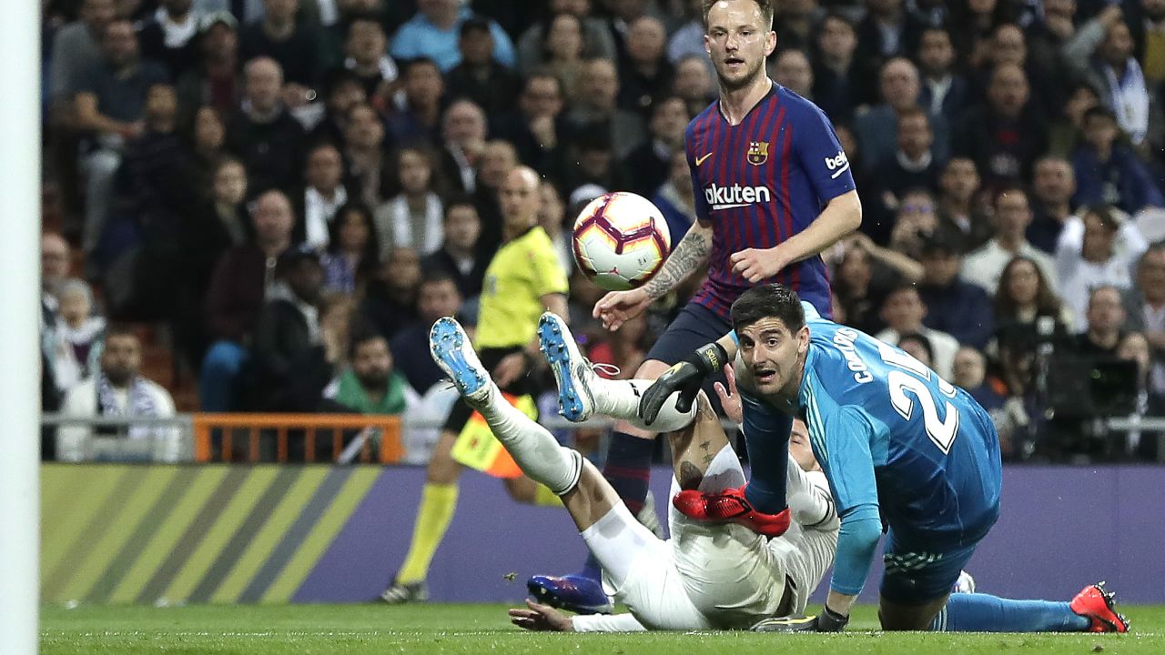 Ivan Rakitic chips the ball over the despairing Thibaut Courtois in the Real Madrid goal to score the only goal of the El Clasico clash.