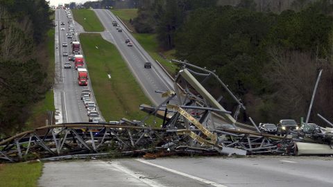 A fallen cell tower lies across U.S. Route 280 highway in Lee County, Alabama, after what appeared to be a tornado struck in the area.
