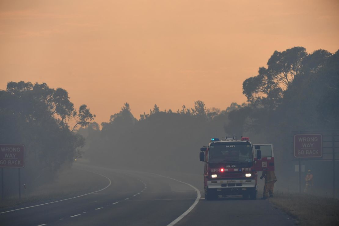 A Country Fire Authority (CFA) crew is seen on the Bunyip side of the Princes Highway on Sunday in the Australian state of Victoria. 