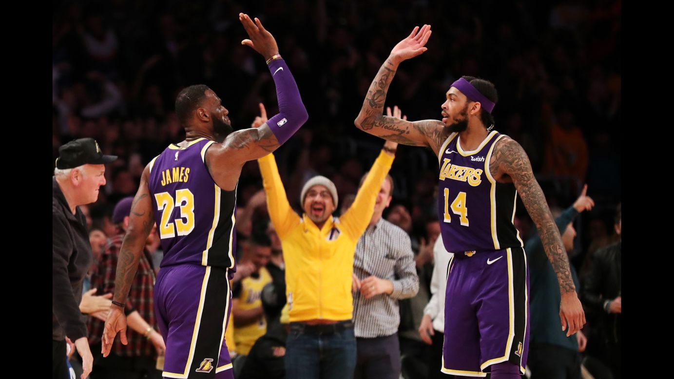 LeBron James of the Los Angeles Lakers, left, celebrates with teammate Brandon Ingram after making a three-pointer during the second half of an NBA game against the New Orleans Pelicans at Staples Center on Wednesday, February 27. The Lakers won the game 125-119.