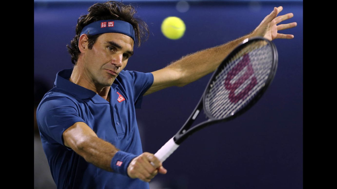 Roger Federer returns a ball in his semifinal match with Borna Coric at the Dubai Duty Free Tennis Championship on Friday, March 1, in Dubai. On Saturday, Federer defeated Stefanos Tsitsipas in the finals to claim<a href="https://www.cnn.com/2019/03/02/tennis/tennis-federer-100-titles-spt-intl/index.html" target="_blank"> his 100th career title.</a>