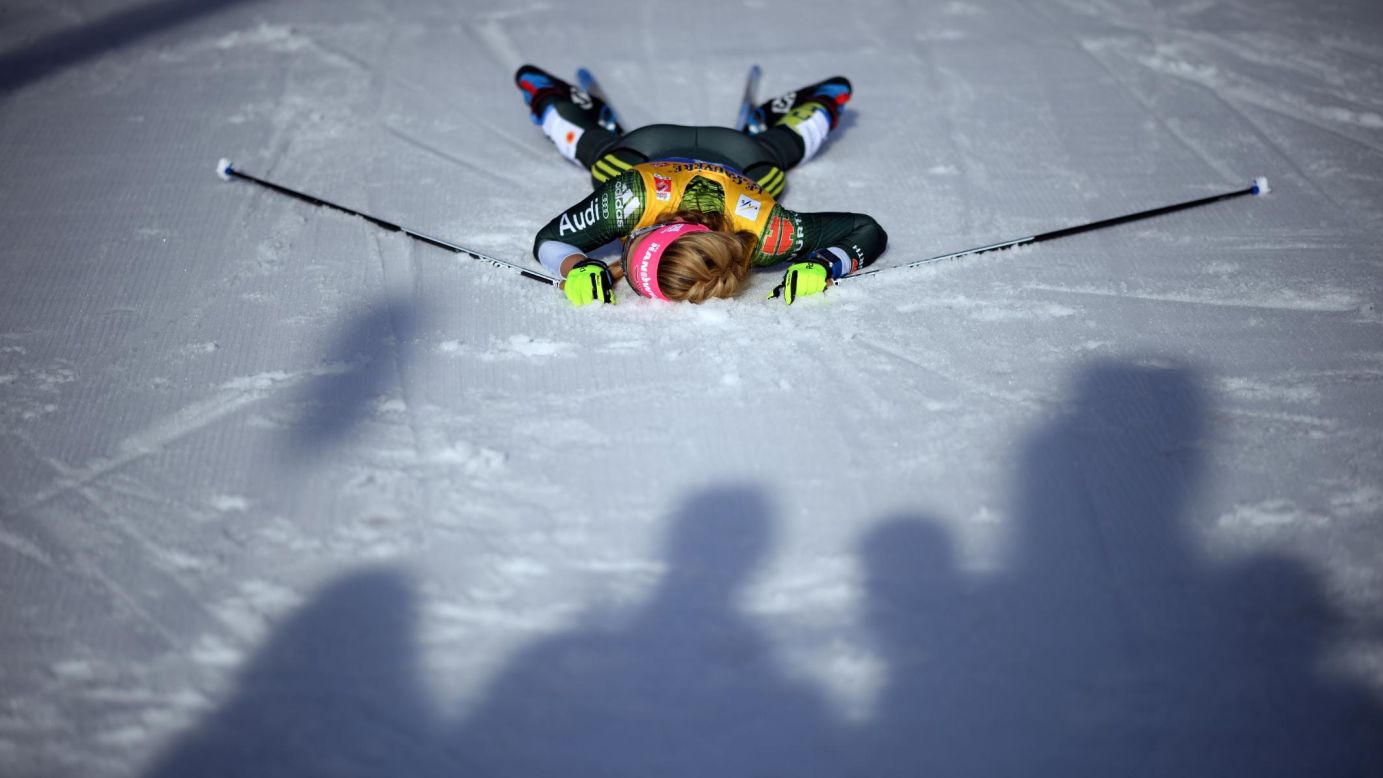 Laura Gimmler of Germany lies on the ground after crossing the finish line of the Cross-Country Women's 10k race of the FIS Nordic World Ski Championships on February 26, in Seefeld, Austria.