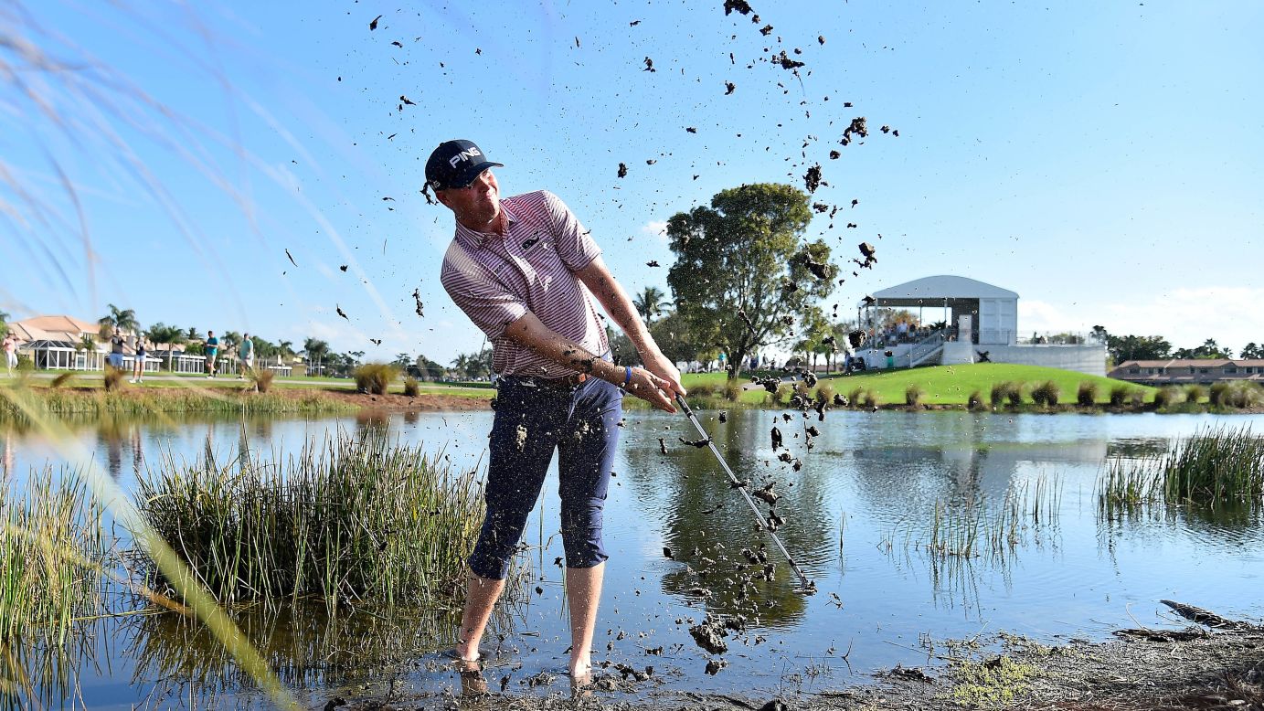 Trey Mullinax plays his ball from the mud off the 9th fairway during the first round of The Honda Classic at PGA National in Palm Beach Gardens, Florida, on Thursday, February 28.