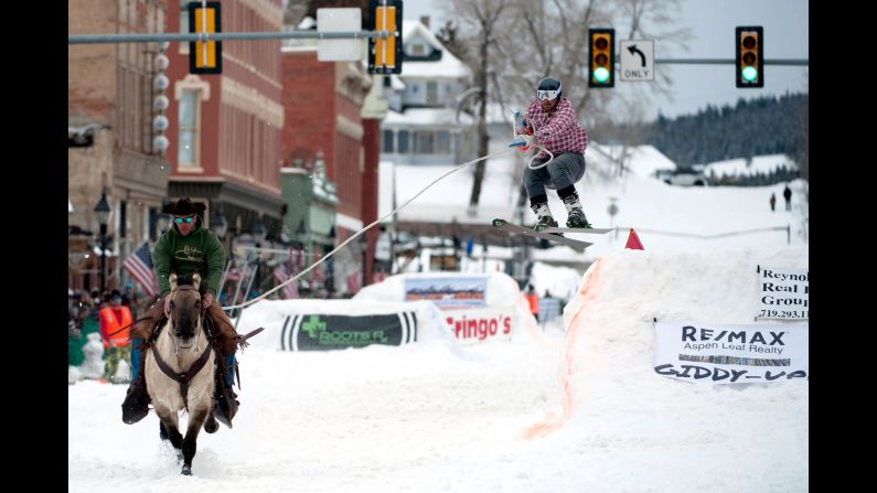 Alan Mikkelson races on horseback down Harrison Avenue in Leadville, Colorado, while skier Jason Dahl airs off a jump at the 71st annual Leadville Ski Joring competition on March 2. Skijoring, which has its origins as a competitive sport in Scandinavia, has been adapted over the years to include jumps and slalom gates. Leadville has been hosting skijoring competitions since 1949.