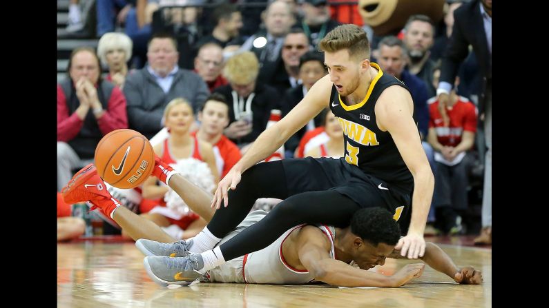 Ohio State Buckeyes guard C.J. Jackson battles for the ball with Iowa Hawkeyes guard Jordan Bohannon during the first half of an NCAA basketball game at Value City Arena on February 26. <a href="index.php?page=&url=https%3A%2F%2Fwww.cnn.com%2F2019%2F02%2F24%2Fsport%2Fgallery%2Fwhat-a-shot-sports-0224%2Findex.html" target="_blank">See 25 amazing sports photos from last week</a>
