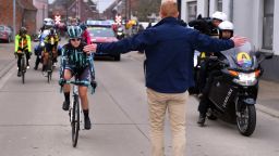 Swiss cyclist Nicole Hanselmann said it was an "awkward moment" when she caught up with the men's support vehicles in the race in Belgium.
