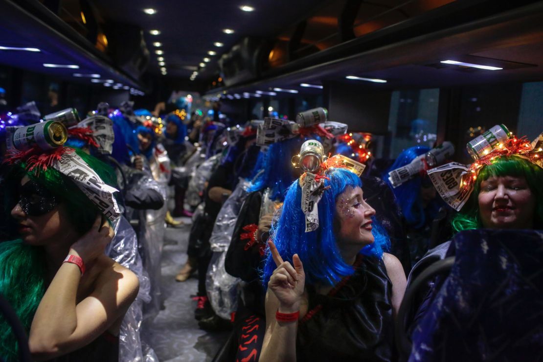 Members of the Krewe of Muses filled dozens of buses.
