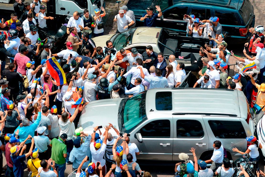 Juan Guaido is greeted by supporters upon his arrival in Caracas on Monday.