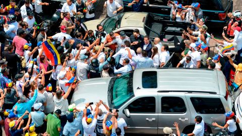 Juan Guaido is greeted by supporters upon his arrival in Caracas on Monday.