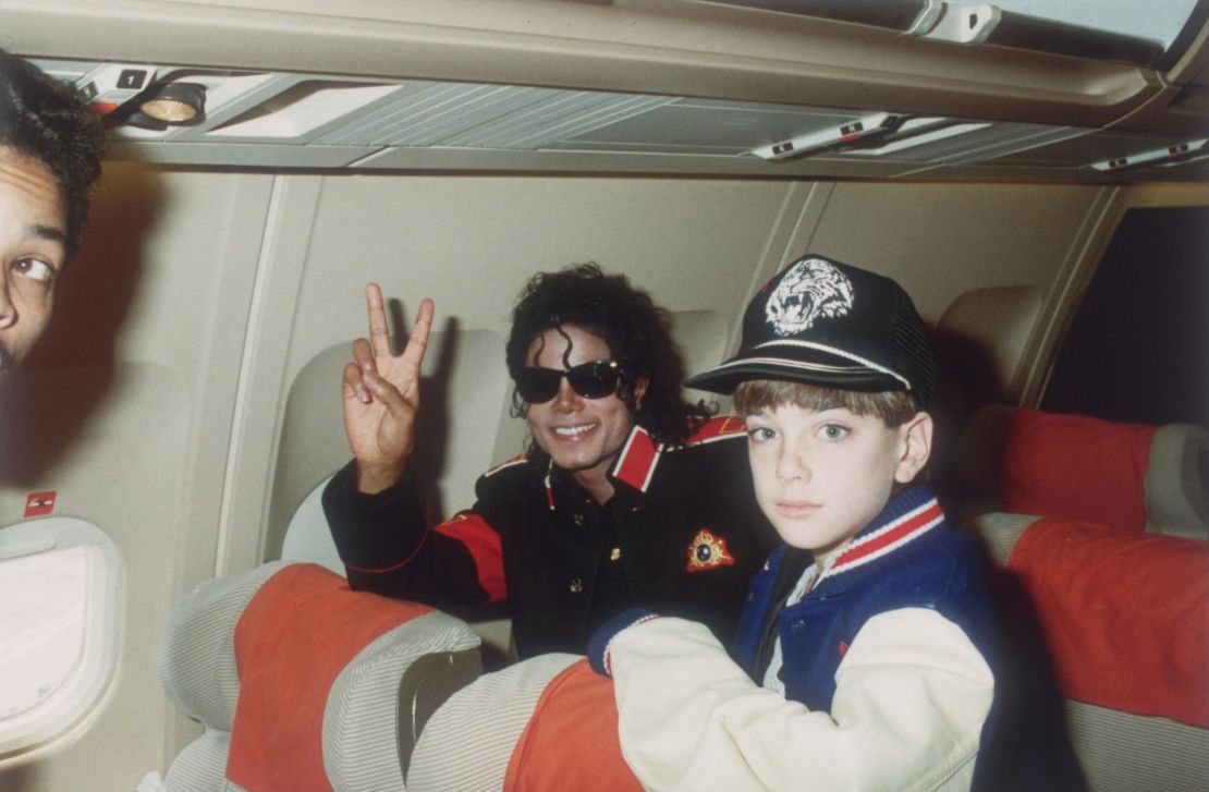 Michael Jackson pictured with James Safechuck, then aged 10, on a tour plane in 1988.
